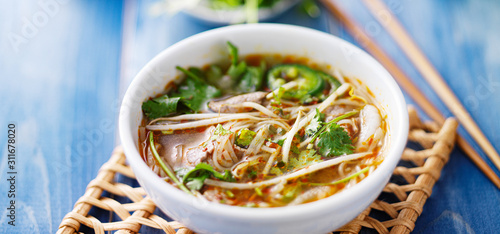 bowl of vietnamese pho with sliced beef photo