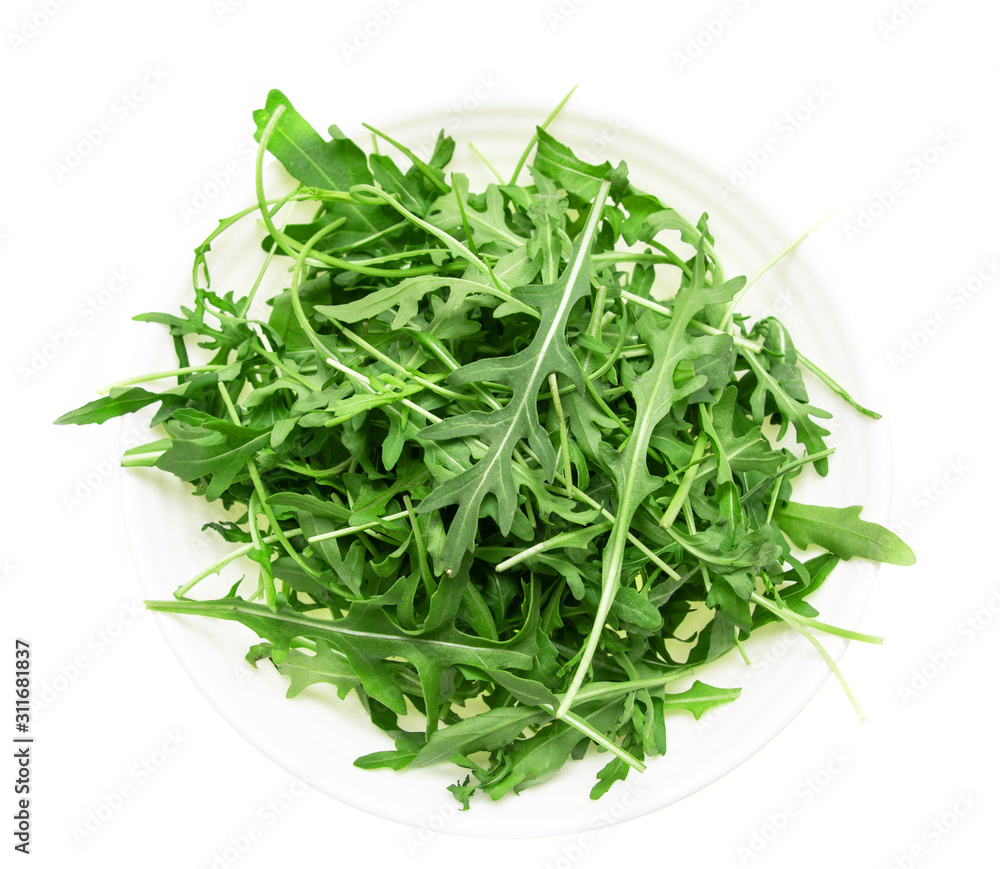 fresh arugula leaves on a white background fresh arugula leaves on a white background