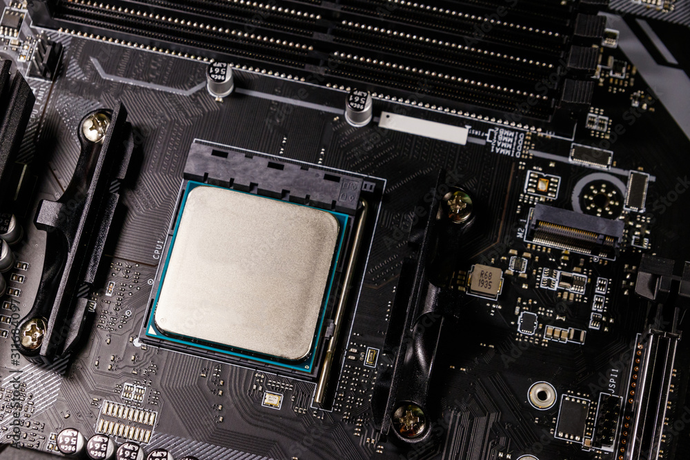 Fototapeta premium Close-up of a modern computer motherboard with installed cpu. Electronic computer hardware technology