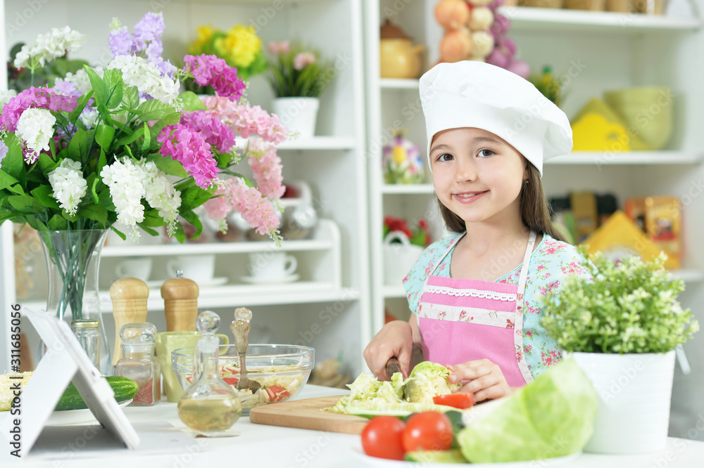 Cute girl preparing delicious fresh salad in kitchen Cute girl preparing delicious fresh salad in kitchen