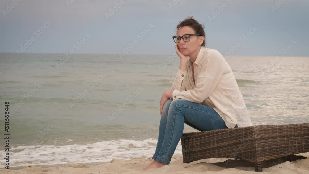 Upset women on the beach.