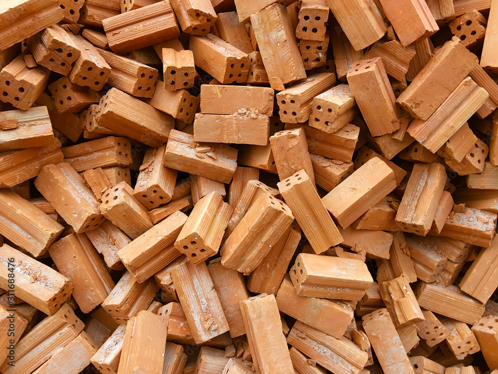 Pile of red bricks for construction. Brick block texture. Pile of red bricks for construction. Brick block texture.