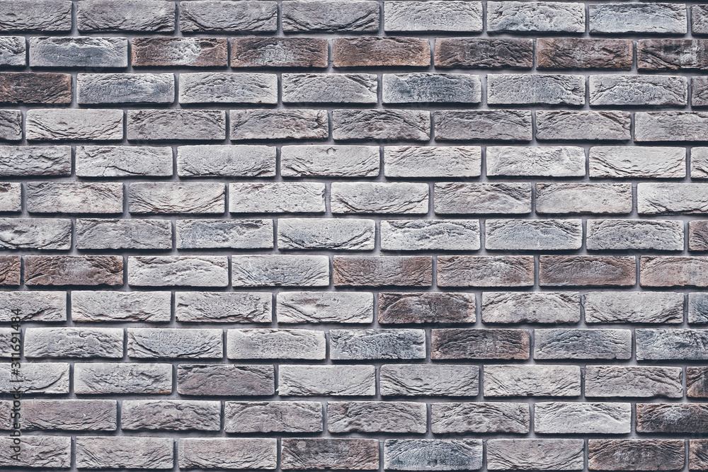 Brown brick wall texture. Gray grunge brickwork. Decorative tile surface. Bricks backgrounds. Messy wall pattern for wallpaper design. Concrete stone background. Brown brick wall texture. Gray grunge brickwork. Decorative tile surface. Bricks backgrounds. Messy wall pattern for wallpaper design. Concrete stone background.