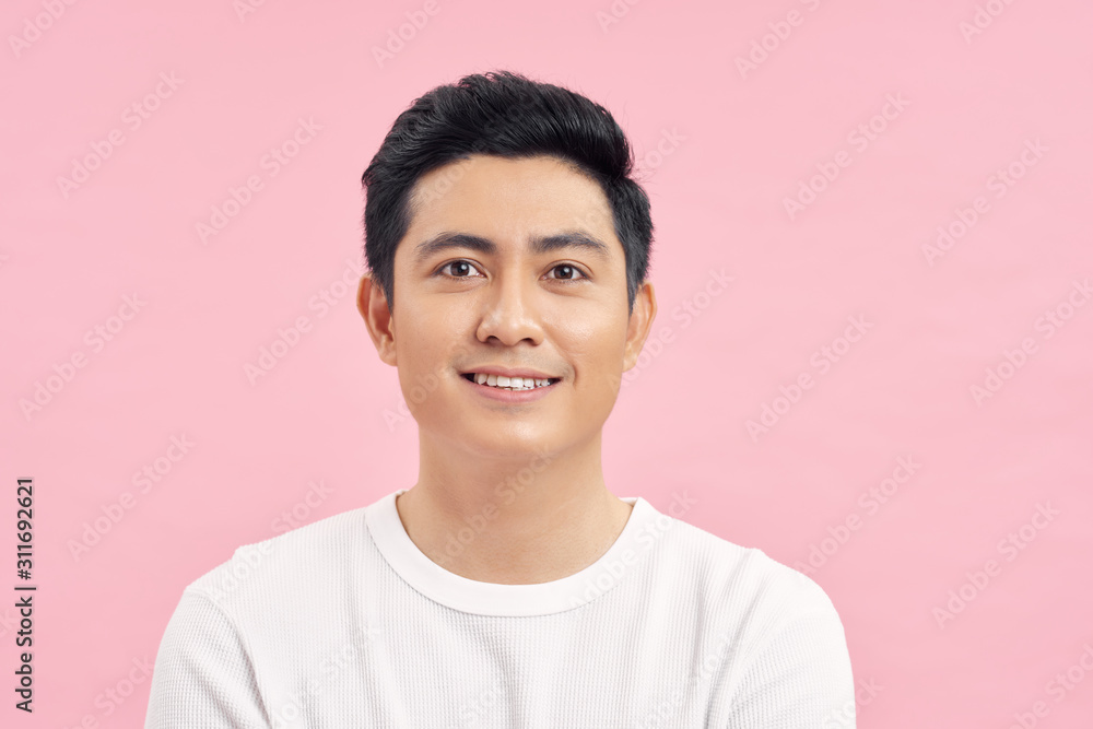 Young Asian man close up shot isolated on pink Young Asian man close up shot isolated on pink