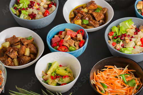 Appetizers and salads, meat and fish dishes of Thai cooking.
