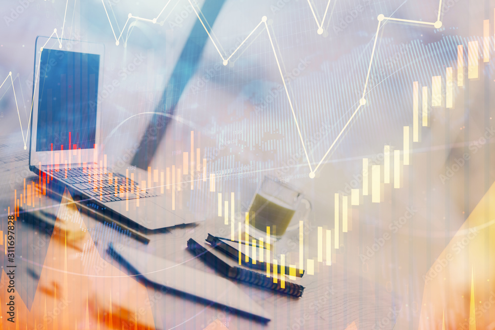 Stock market graph on background with desk and personal computer. Double exposure. Concept of financial analysis. Stock market graph on background with desk and personal computer. Double exposure. Concept of financial analysis.