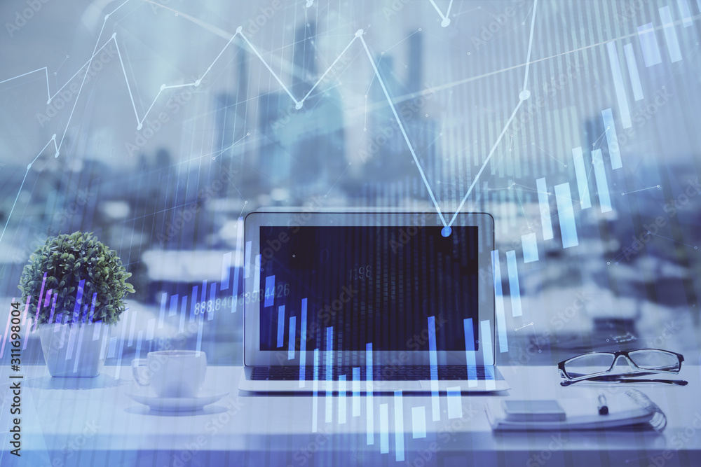 Forex graph hologram on table with computer background. Multi exposure. Concept of financial markets. Forex graph hologram on table with computer background. Multi exposure. Concept of financial markets.