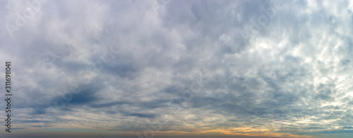 Fantastic clouds against blue sky, panorama