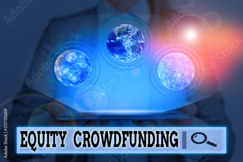 Writing note showing Equity Crowdfunding. Business concept for raising capital used by startups and earlystage company Elements of this image furnished by NASA photo