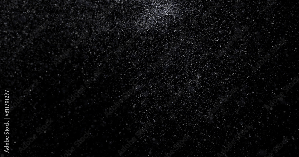 Natural white winter snowfall on a black background