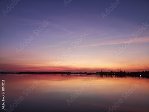 sunset over lake © Dararat