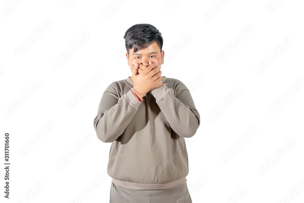 Portrait of fatty boy closed his mouth with his hands isolated on white background. Portrait of fatty boy closed his mouth with his hands isolated on white background.
