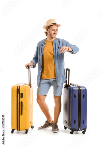 Young tourist with luggage ...