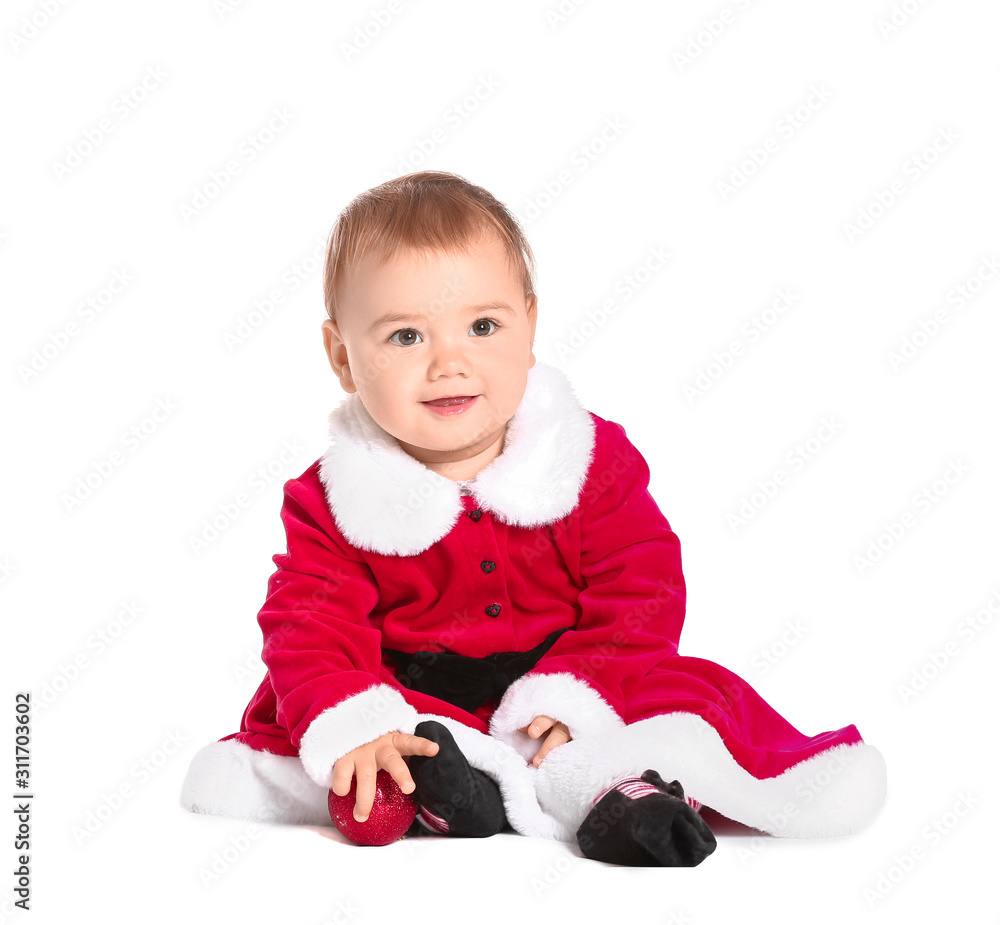 Cute little baby in Santa Claus costume and with Christmas ball on white background Cute little baby in Santa Claus costume and with Christmas ball on white background