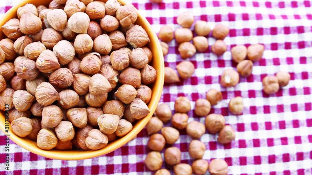 Fresh hazelnuts in a bowl, top view Fresh hazelnuts in a bowl, top view