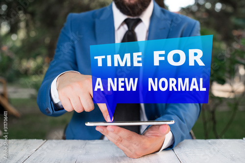 Text sign showing Time For A New Normal. Business photo showcasing Make a big dramatic change Replace the expected Businessman with pointing finger in front of him photo