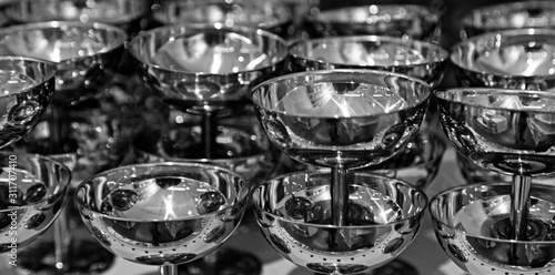 silver cups stacked on each other in shelf at department stores