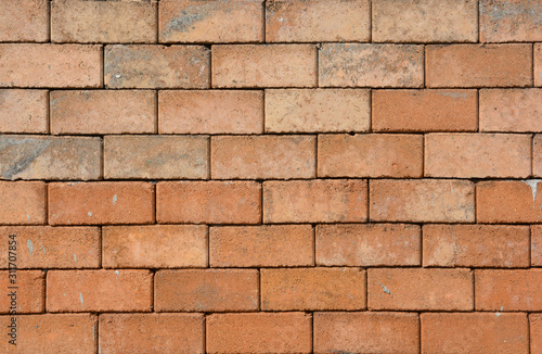 Brick wall , Brick is a popular medium for constructing buildings