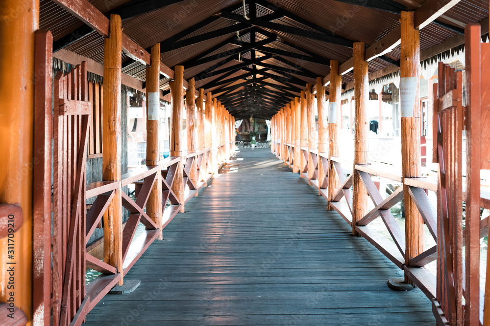 Semporna, Malaysia - Nov 27, 2019: Perspective of the wooden bridge. photograph of the bridge. Perspective. Gallery.