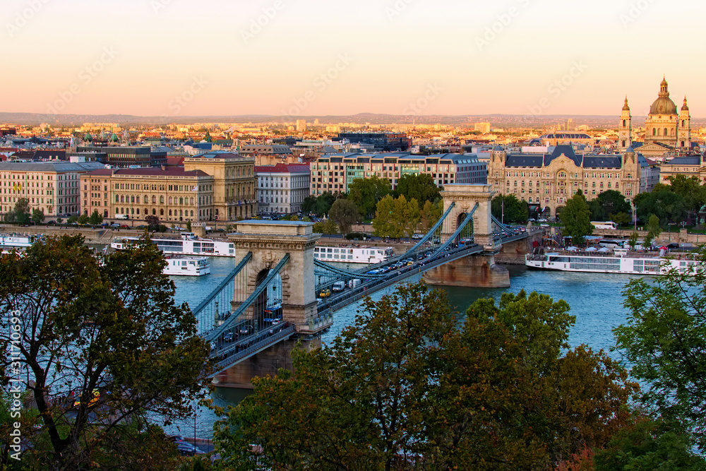 Beautiful landscape photo of ancient Budapest. One of the main attractions are the Chain Bridge over  Danube River and Basilica of Saint Stephen. Travel and tourism concept. Budapest, Hungary