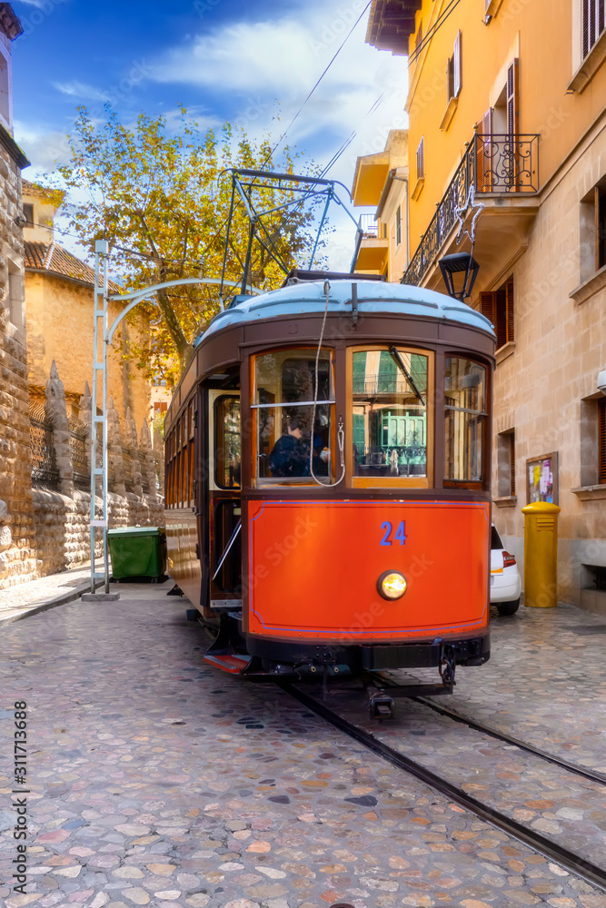 Nostalgic tram runs through the old town of Soller, Mallorca, Spain