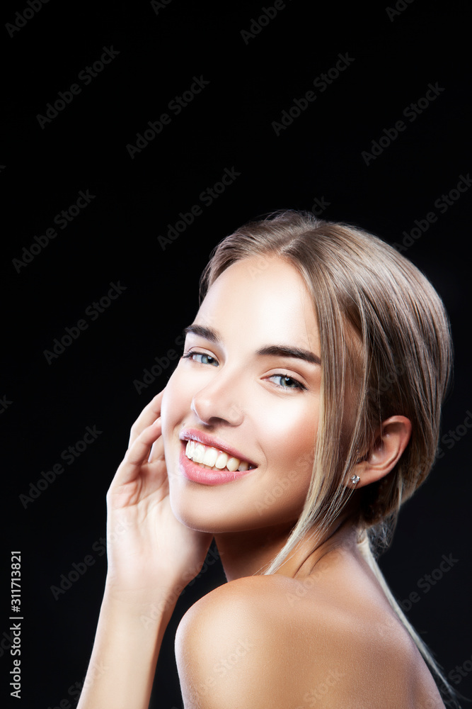 Beautiful hapy model woman, teeth smiling, perfect skin, makeup, blonde hair style. Black background. Copy space Beautiful hapy model woman, teeth smiling, perfect skin, makeup, blonde hair style. Black background. Copy space