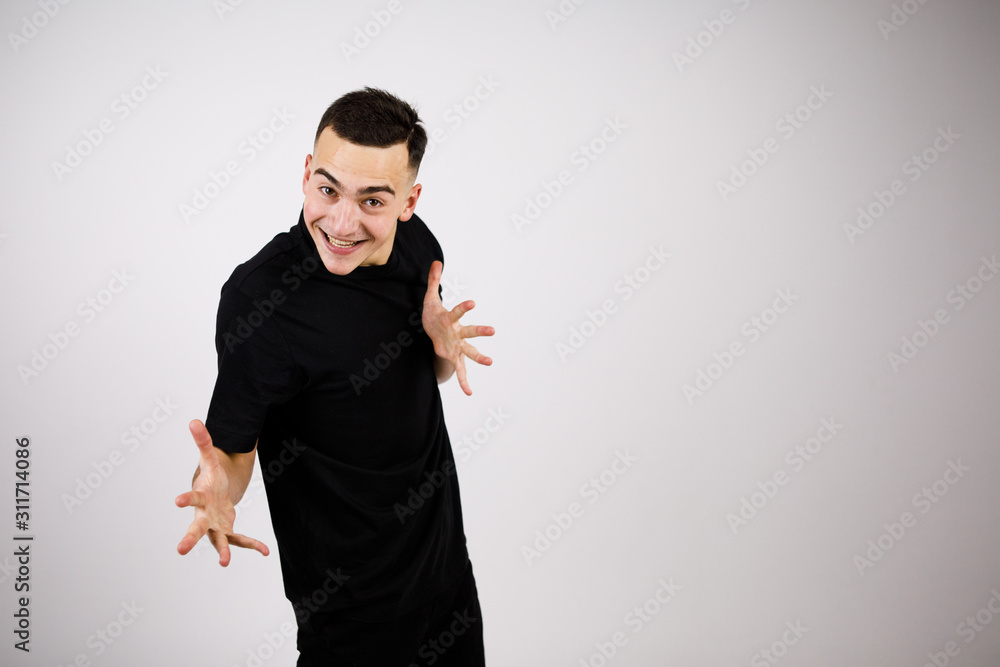 Cheerful guy shows his palms Cheerful guy shows his palms
