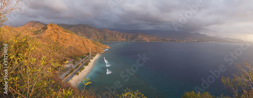 Sunset over the ocean at Cape Fatucama viewed from the Cristo Rei Jesus Statue in Dili, East Timor. photo