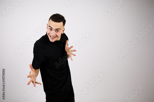 Cheerful guy shows his palms