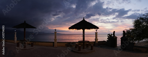 Sunset over the ocean at Cape Fatucama viewed from the Cristo Rei Jesus Statue in Dili, East Timor. photo