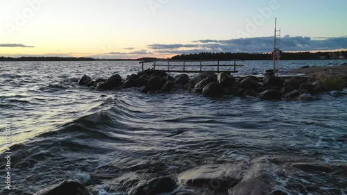 Waves at Helsinki Finland captured with drone, old ruggerd pier photo