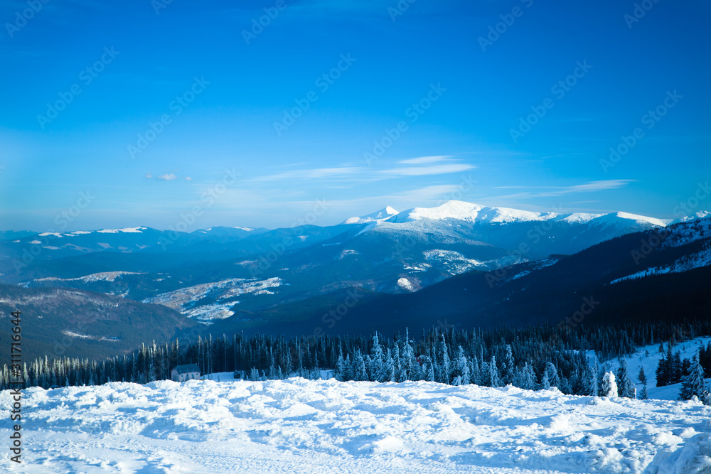 Landscape of snow winter valley and mountains on sunny day