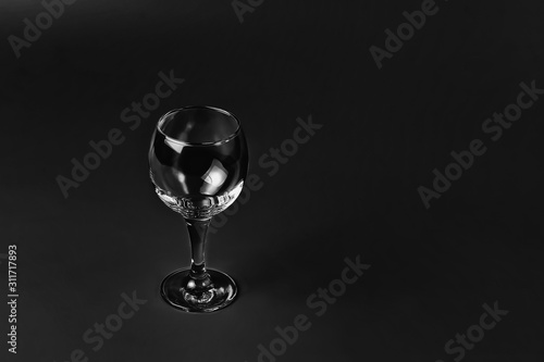 Empty wine glass on black background 
