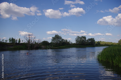 hot summer, blue sky, white clouds, on the river