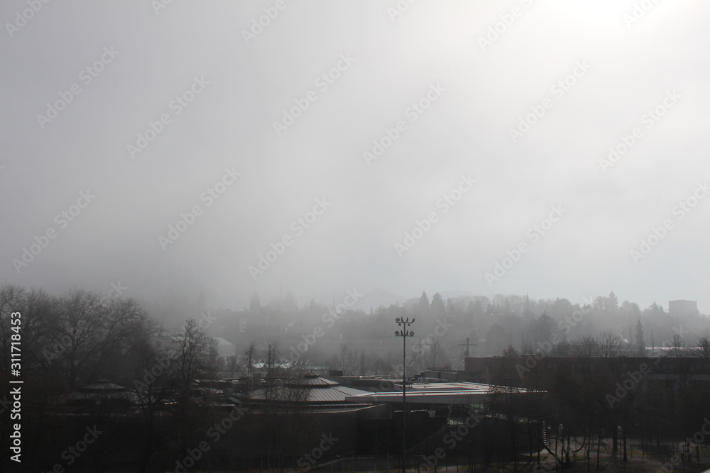 A view of Bregenz city in fog, taken from the famous Lake Stage (Seebuehne) theater in Vorarlberg, Austria. A view of Bregenz city in fog, taken from the famous Lake Stage (Seebuehne) theater in Vorarlberg, Austria.