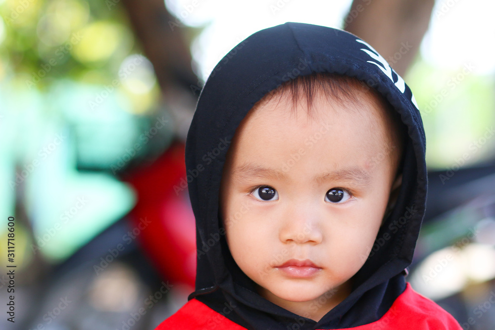 Little adorable boy in black and red hoody Little adorable boy in black and red hoody