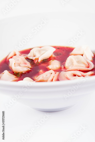 Polish Christmas Eve dish:clear borscht with dumplings (uszka) photo