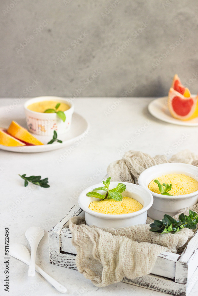 Homemade delicious individual citrus souffle with mint. 