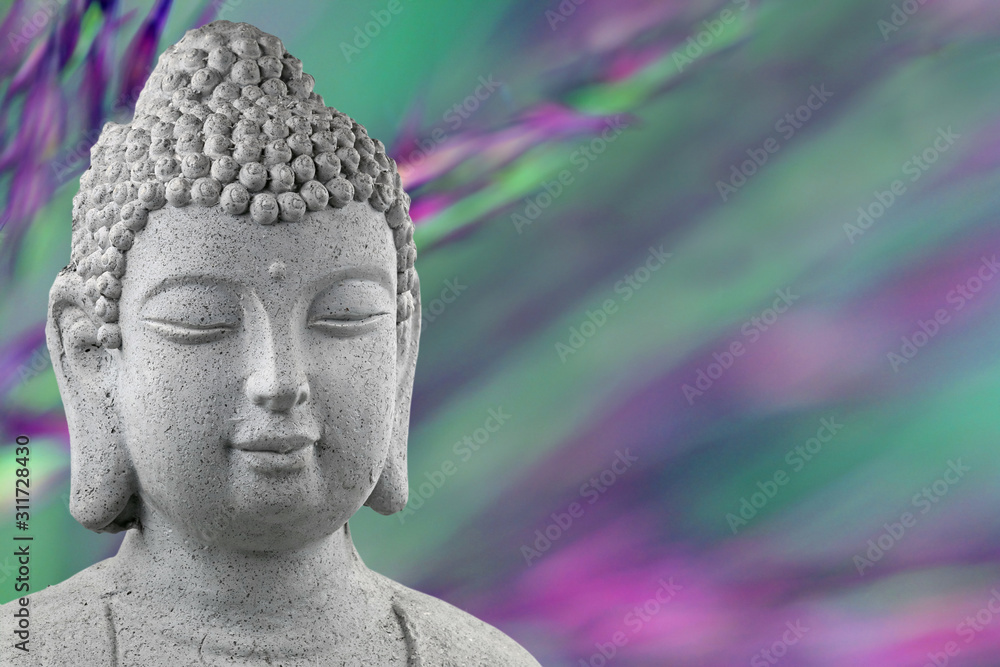 buddha statue head isolated on blurred green and purple background with copy space