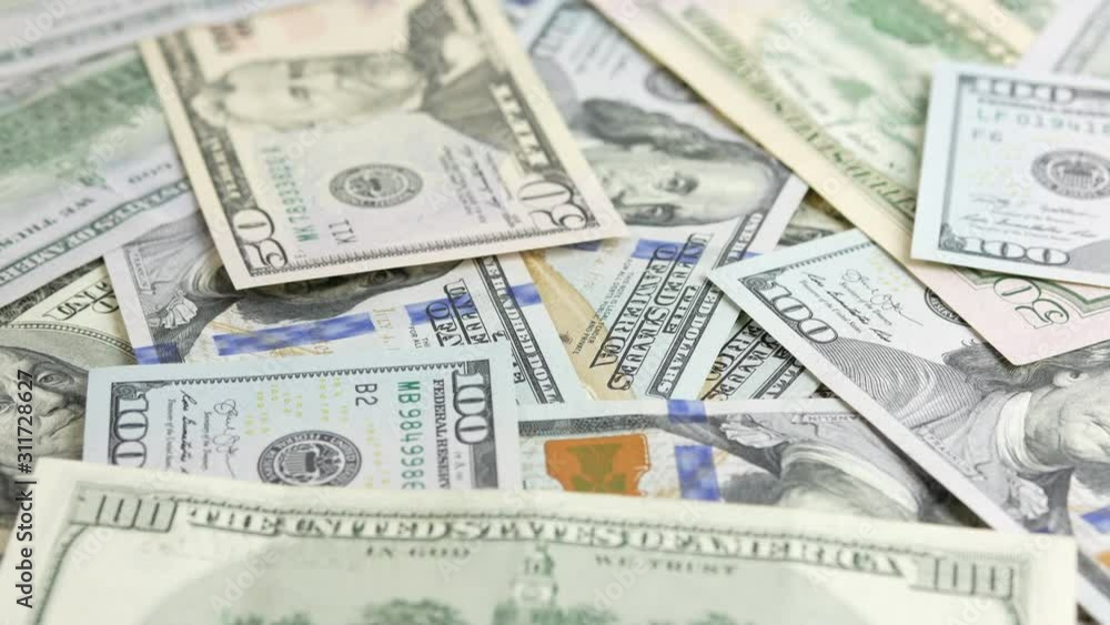 One hundred dollar bills rotating One hundred dollar bills rotating