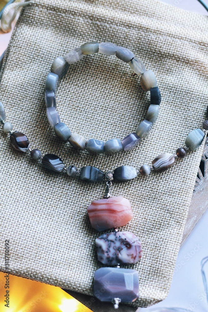 Jewelry composition on interior background with bokeh