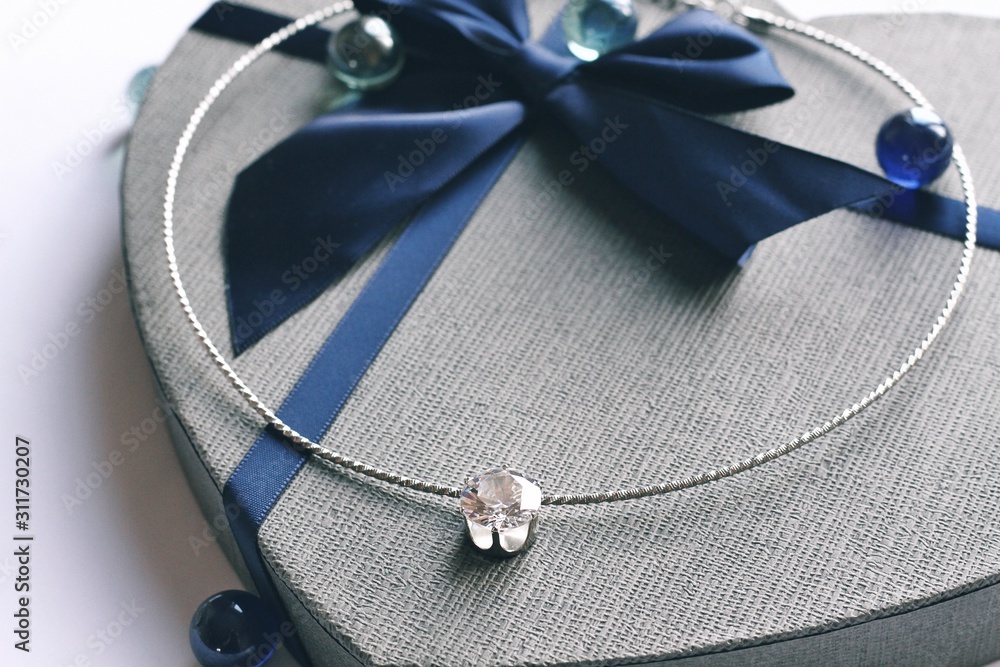 Jewelry composition on interior background with bokeh