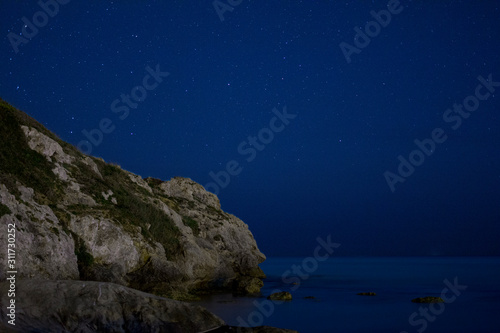 Cliff over the sea at night