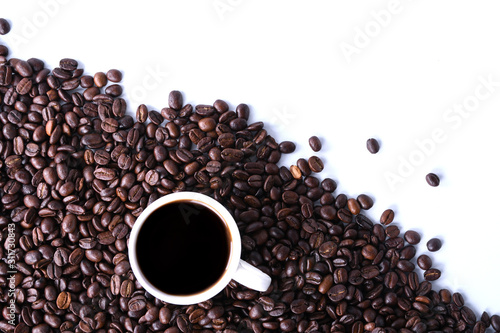 Fototapeta Naklejka Na Ścianę i Meble -   Coffee beans and cup of coffee isolated on white background