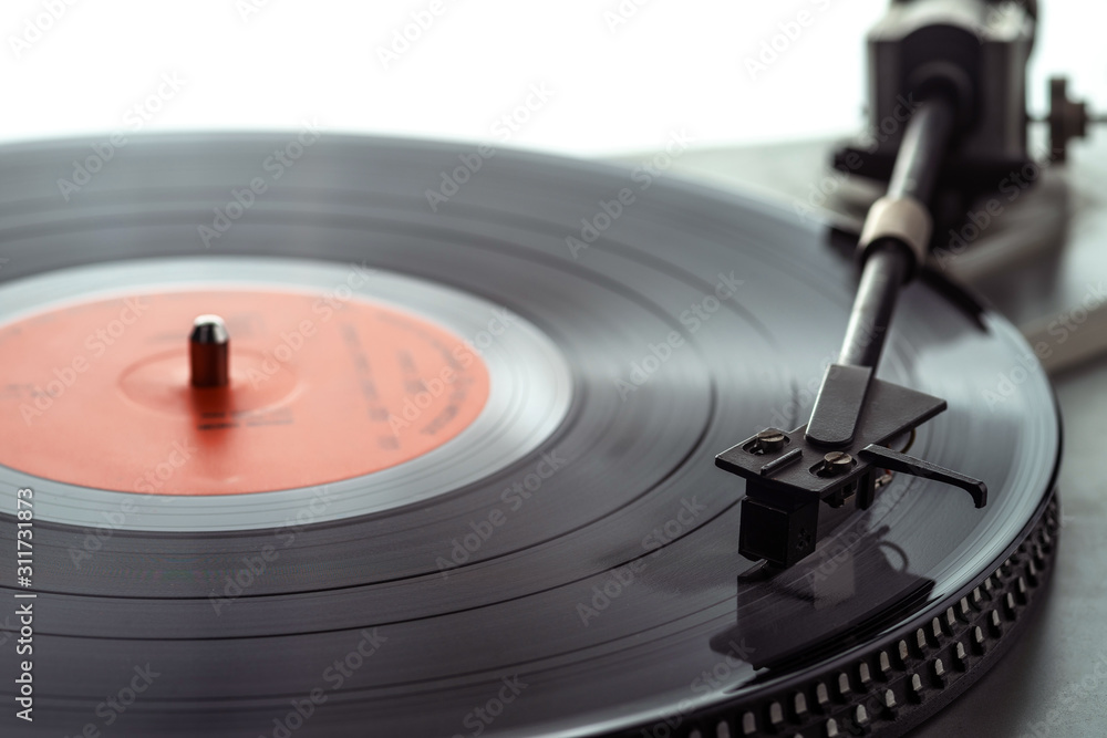 Turntable vinyl record player. The tonearm on a vinyl record. Selective focus. Turntable vinyl record player. The tonearm on a vinyl record. Selective focus.