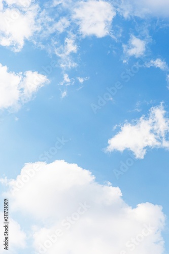 Blue sky background. Blue sky with fluffy white clouds