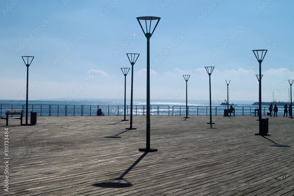 Sea pier with sreet lamps