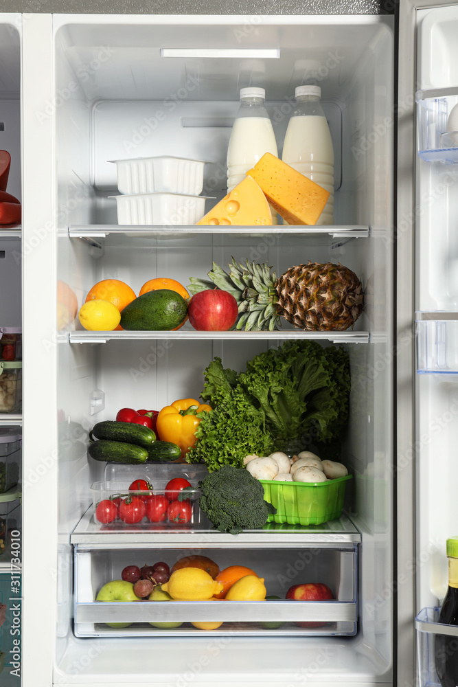 Open refrigerator full of different fresh products Open refrigerator full of different fresh products