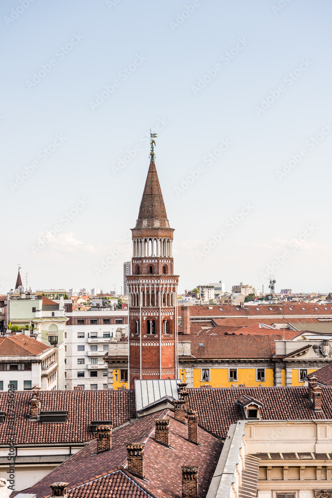   Aerial view of the old downtown of the Milan City with beautiful rooftops, view from the top of cathedral church of Milan, Lombardy, Italy.
