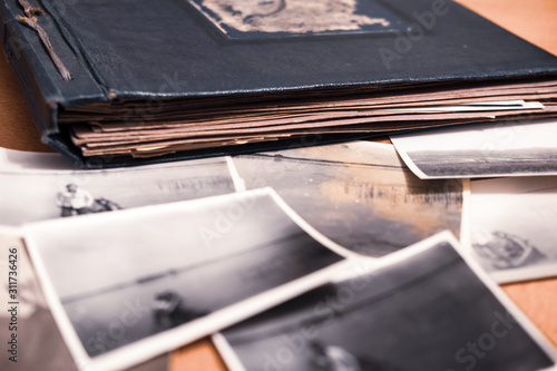 Old watch and photos, family ancestry, memories concept 